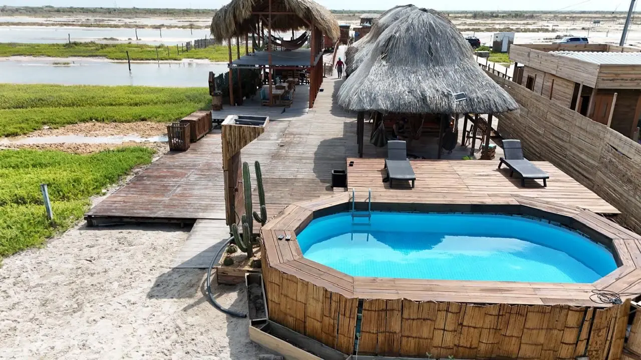 Real exterior view of La Costa House and its swimming pool in Mayapo
